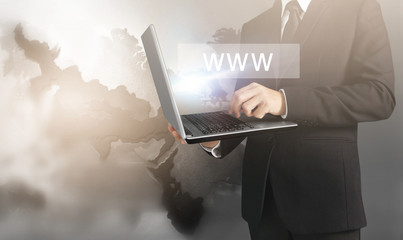  business man and suit holding laptop in hands