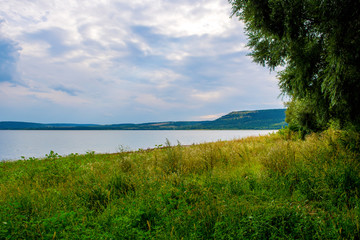 Photo of a beautiful beach near blue bay at summer