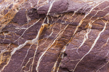 Colorful rock with veins close-up detail 