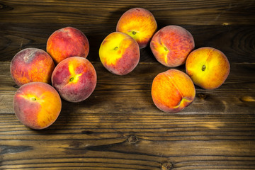 Ripe peaches on wooden table