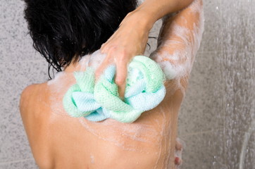Woman closeup in the home shower