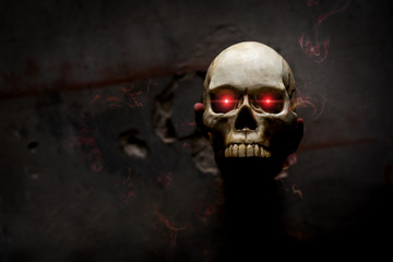 Hand death the ghost holding skull bone skeleton with Flame blood is screaming darkness and...
