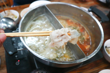 eat sliced pork or  Sukiyaki