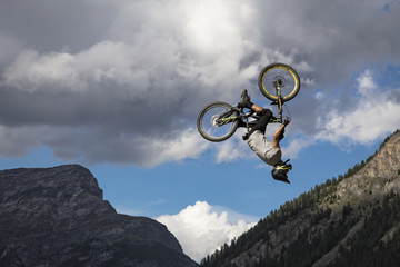 Freestyle biker doing flying stunt