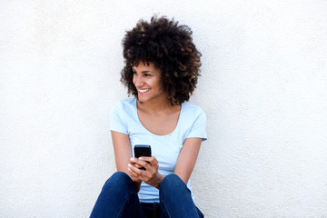 Happy woman with mobile phone isolated on white background