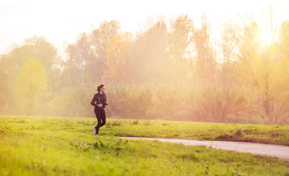 Woman Jogging At Park