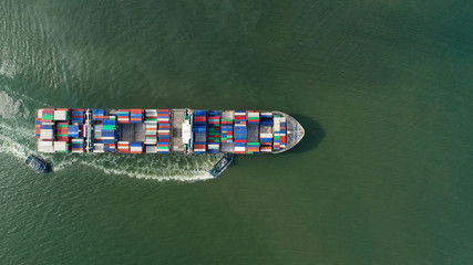 Fototapeta premium container,container ship in import export and business logistic,By crane,Trade Port , Shipping,cargo to harbor.Aerial view,Water transport,International,Shell Marine,transportation,logistic,trade,port