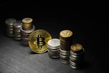 Golden bitcoin with money coins background. Bitcoin on black background