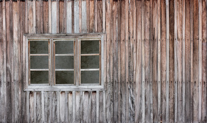 Old wooden window with grunge wood wall.