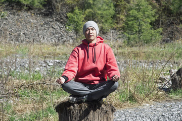 Young man sitting and meditating