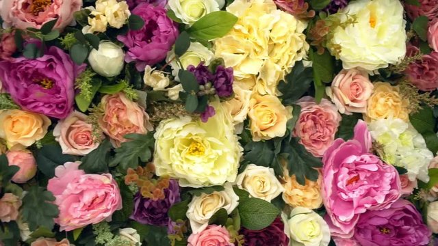 Beautiful flower field yellow green white pink purple and red lot of roses and peonies stand in