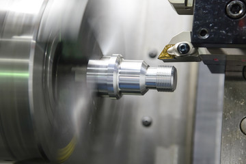 CNC lathe machine (Turning machine) cutting the metal  screw thread part .Hi-precision CNC...