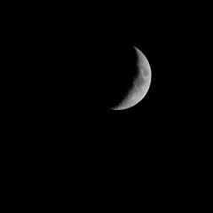 Obraz na płótnie Canvas Crescent Moon in Dark Night Sky