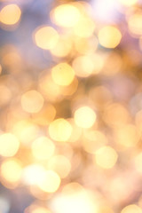 Golden Christmas background with natural  bokeh and twinkled defocused lights. Festive blur...