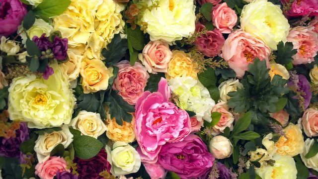Beautiful flower field yellow green white pink purple and red lot of roses and peonies stand in