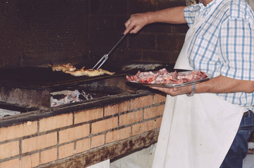 Closeup on fresh meat ready for grilling process. Cooking food dining party background concept