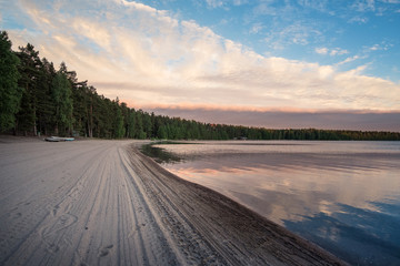 Sunset on beach with mood light At summer evening in Nurmijärvi, Finland
