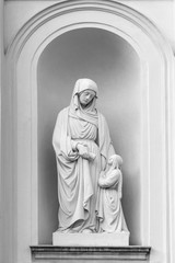 White marble sculpture of Virgin Mary with little child