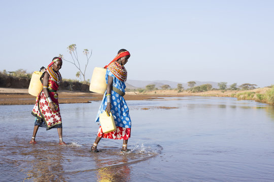 Women from Samburu tribe collecting water. Kenya, Africa