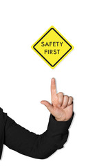 Woman hand pointing of finger at Warning label Safety. Signs symbols, Safety in factory Concept