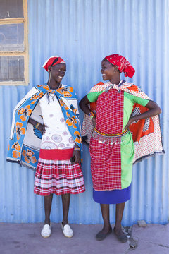 Two women from the Maasai tribe in colourful costume. Kenya, Africa.