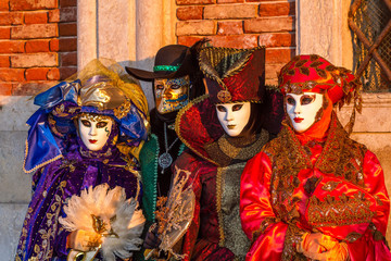 Fototapeta na wymiar Group of masked costume characters at Venice Carnival