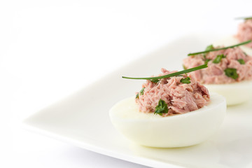 Stuffed eggs with tuna isolated on white background

