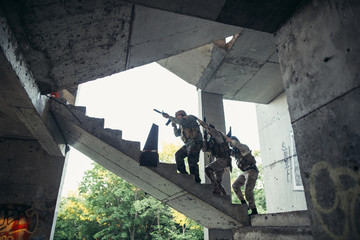 Army soldiers during the military operation. war, army, technology and people concept