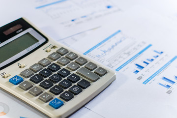Close up business concept, Calculator on financial report on table office