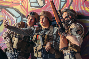 Selfie. group of soldiers taking selfie with smartphone