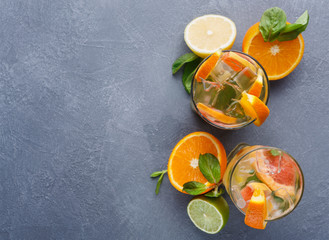 Colorful summer background with citrus drinks and fruits