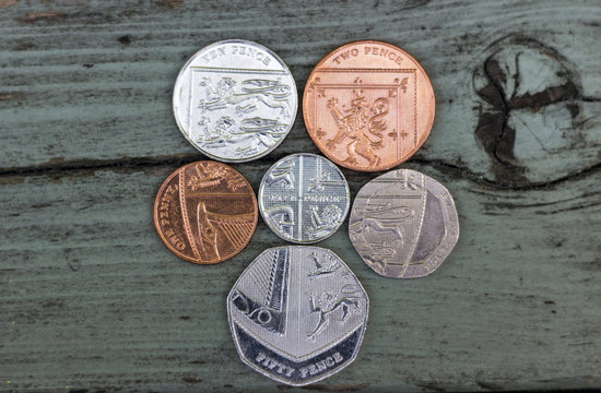 British coins arranged to show the shield