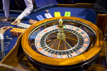 Wooden Roulette table in casino chips