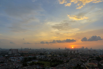 Fototapeta premium A majestic sunset in downtown Kuala Lumpur, the capital of Malaysia. Its modern skyline is dominated by the 451m tall KLCC, a pair of glass and steel clad skyscrapers.