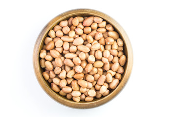 peanut in wooden bowl isolated on white background ,top view