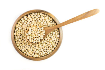 Soybeans in wooden bowl isolated on white background ,top view