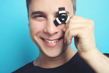 The guy is playing with a spinner on a blue background.