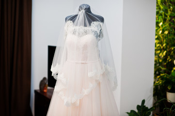 Wedding dress in the middle of the room isolated.