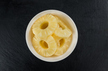 Portion of Preserved Pineapple Rings on a slate slab