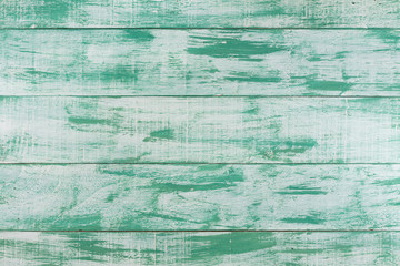 Green mint painted wood board background, top view