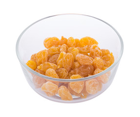 Dry yellow plums in bowl on white background