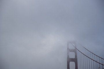 Golden Gate Bridge seen in fog from Marin Headlands side fo the bay