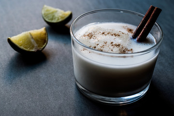 Horchata with Cinnamon stick and lime.