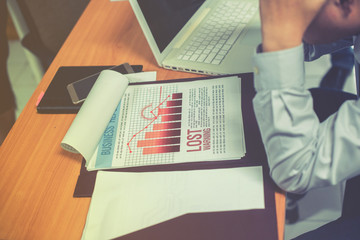 Group of business people analysis with marketing report graph, Young specialists are discussing business ideas for new digital start up project, Financial, accounting, investment, Selective focus.
