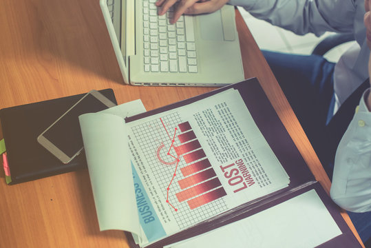 Group of business people analysis with marketing report graph, Young specialists are discussing business ideas for new digital start up project, Financial, accounting, investment, Selective focus. - Powered by Adobe