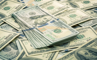 Lot of one hundred dollar bills close-up background