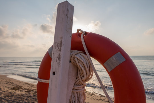 Life preserver on a beach at sunrise (Guardamar del Segura, Spain)