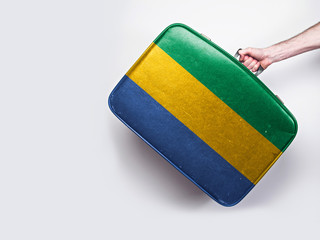 Gabon flag on a vintage leather suitcase.