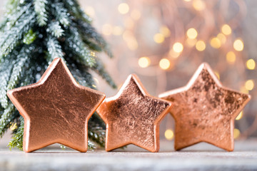 Christmas bronze decoration. Holiday decorations bronze on bokeh background.