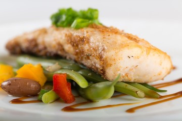 Fried fish with vegetable.